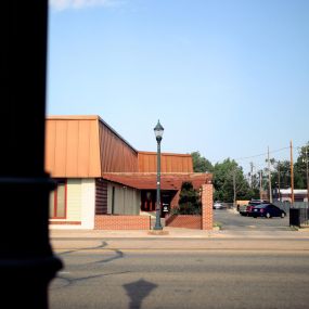 View of the entrance to the building from across 8th Ave