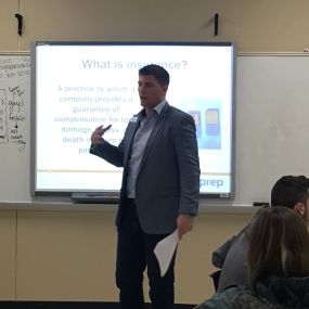 Greg Sniezek volunteering with BestPrep, speaking in a local high school classroom