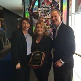 Agency owner, Dolly Wasielewski, receiving Best in Company award from Senior Leadership.