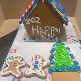 It’s not only a time for giving, but a time for fun, delicious crafts! Our staff member, Emily, entered a gingerbread house making contest!