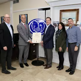 Hempstead Town Councilman Chris Schneider Presenting The Conneely Agency with the Small Business Spotlight for their work in the local community.