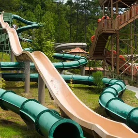 You'll scream with excitement as you race down your choice of winding corkscrew tunnels or aggressive quadruple-drop slides.