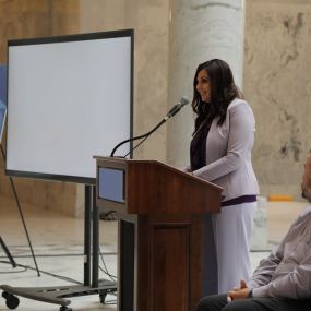 Shonie speaking at the Utah State Capitol for domestic violence awareness.