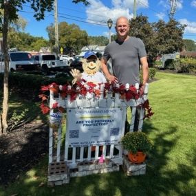 Rob Longyear, with Woodstock agency scarecrow