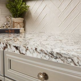 Calacatta Capella is classic white quartz with grey, marble-like veining strewn throughout. This dramatic detail gives the material the look of natural stone and adds character to its clean and simple backdrop.