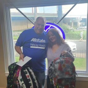 Donating backpacks and school supplies for a local back-to-school drive.