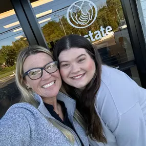 Sarah and Savanna at front office door