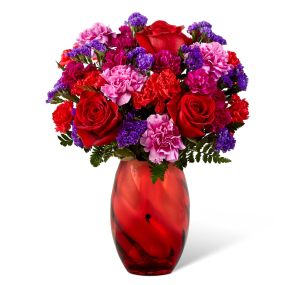 This timeless red bouquet will make a statement for your special someone. Red  & Purple flowers are an elegant, iconic and romantic gift for anyone close to your heart. Each flower arrangement is handcrafted and hand delivered to say I Love You!
