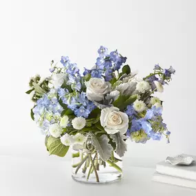 Celebrate any occasion with the Clear Skies Bouquet! A fresh hydrangea arrangement with blue delphinium & roses. Same day flower delivery available in Westerly!