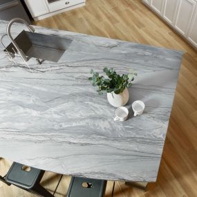 This grey quartzite will have darker grey veining along lighter grey movement. 