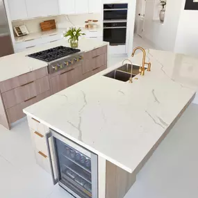 Calacatta Capella is classic white quartz with grey, marble-like veining strewn throughout. This dramatic detail gives the material the look of natural stone and adds character to its clean and simple backdrop.