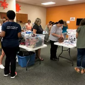 We were proud to support Living Water Community Church, in Harrisburg, where we dedicated a morning to lend practical support to their “She’s Somebody’s Daughter” with organizing donated items and purses for distribution.