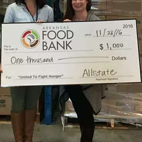 Jennifer King, Allstate Insurance Agent in Little Rock, AR presents check to Arkansas Food Bank.