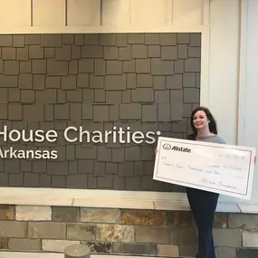 ennifer King, Allstate Insurance Agent in Little Rock, AR presents check to Charity