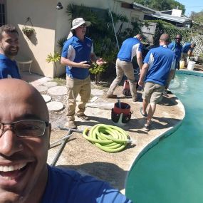 Pool Troopers Technicians Servicing a Pool