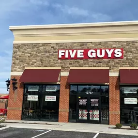 Exterior photograph of the Five Guys restaurant at 12737 Stone Village Way in Midlothian, Virginia.