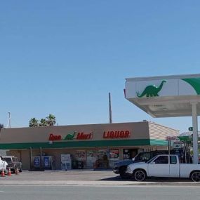 Sinclair DINO Mart with Sinclair gas canopy and fuel pumps