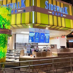 Interior of Sidewalk Cafe at Horseshoe Indianapolis. No matter what you’re craving, you’ll be sure to satisfy your appetite at Sidewalk Café at Horseshoe Indianapolis. This Indianapolis grab-and-go restaurant has everything from burgers to baked goods. Just steps away from the bustling casino, Sidewalk Café has something for everyone. Take your food to-go or grab a seat and enjoy people-watching. Go healthy with a salad or indulge with loaded nachos or pizza. Sidewalk Café is also open for break