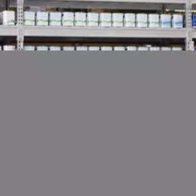 Photo of Lowe's employee watering plants in the Garden Center.