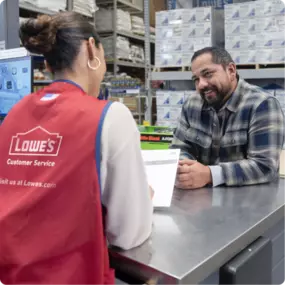 Lowe's employee providing a quote to a customer.