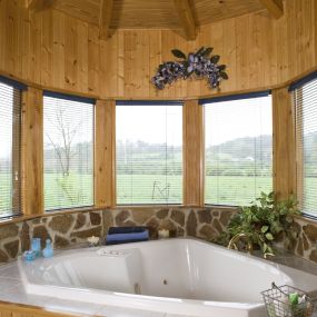 Cypress log home with amazing luxury garden tub. We can build in Florida.