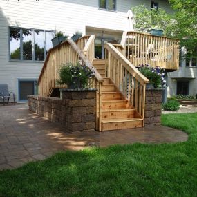 Some of the CB Services Lawn, Landscape and Irrigation landscaping options include retaining walls, sidewalks, paver patios, outdoor living spaces, outdoor fire pits, outdoor kitchens, boulder walls, and rock or mulch installation.