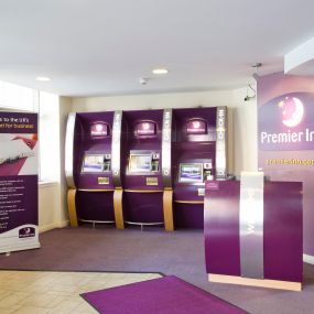 Premier Inn reception with check in desk and kiosks