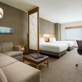 The double/double guestroom features a separate sleeping and living area, with mini-refrigerator, single serve coffee maker, free Wi-Fi, and a Cozy Corner with sofa sleeper.