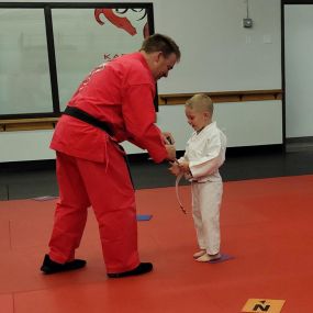 Celebrating milestones and achievements! Our karate belt graduation ceremony captures the essence of progress and dedication