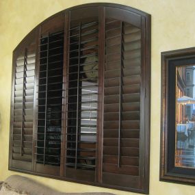 Custom stained arched shutters