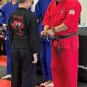 Student receives his brown belt