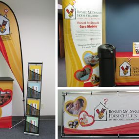 Ronald McDonald House Charities Specialty Event – Design by AM&J Digital
Banner Stand, Table Throw, Flag, Fabric Podium, Monsoon Sign, Table Top Breeze, Carrying Case, and Literature Stand
