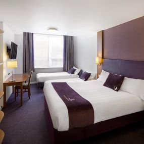 Premier Inn family room with double bed, two single beds and a flat screen TV