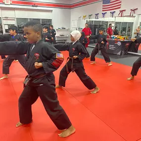 Training their basics and stances to get ready for the Karate Cup 2024!