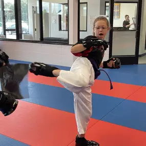 Young girl having fun practicing at Dojo Karate in Rogers, Mn