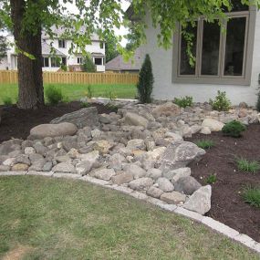 Our team adds beauty to drainage culverts and ditches, edging these natural creek beds with plants or shrubs and lining them with durable, attractive stones.