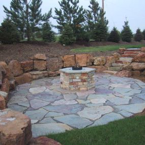 Upgrade your outdoor space with the beauty and resilience of stone. We install and repair a variety of stone features including patios, walkways, driveways, and retaining walls
