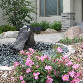 Upgrade your outdoor space with the beauty and resilience of stone. At Designing Nature Landscaping Services, our team can help your repair and install a variety of different stone features including patios, driveways, retaining walls, and much more.