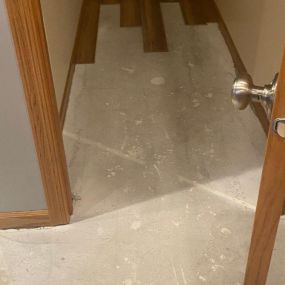 Pictured here is water damage in a Minneapolis basement hallway.