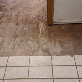 Pictured here is Minneapolis water damage in a kitchen.  For this kitchen, we removed the floor tile in the water-damaged areas.