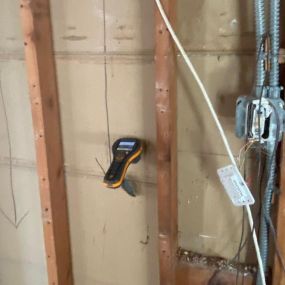 Pictured here is a moisture meter for Minneapolis water damage.  As you can see, we are using the moisture meter to pinpoint the water origination source and to determine where it is going.
