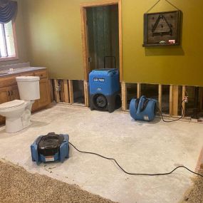 Pictured here is Minneapolis water damage restoration in a lower-level entertainment room.  Visible in the picture is a sink.
