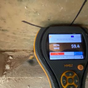 Pictured here is a moisture meter for Minneapolis water damage.  We use a moisture meter to detect water behind walls.  As you can see, this area of drywall is 59% wet.