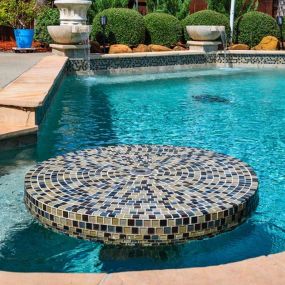 Custom pool with pool seating for eating and drinking