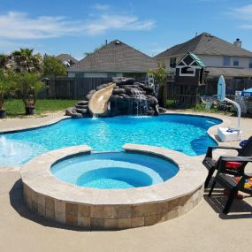 Pool with spa, fountains, waterfall with slide