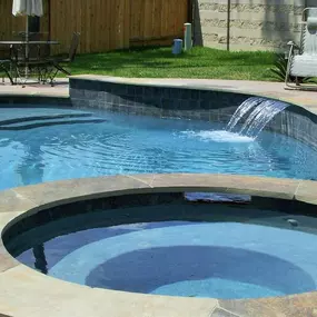 Freeform pool with spa