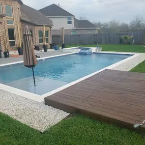 Rectangular swimming pool with umbrella stand in pool