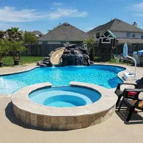 Pool with spa, fountains, waterfall with slide