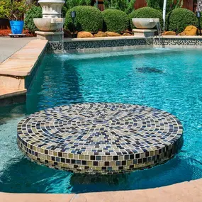 Custom pool with pool seating for eating and drinking