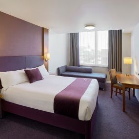 Premier Inn bedroom with double bed and sofa